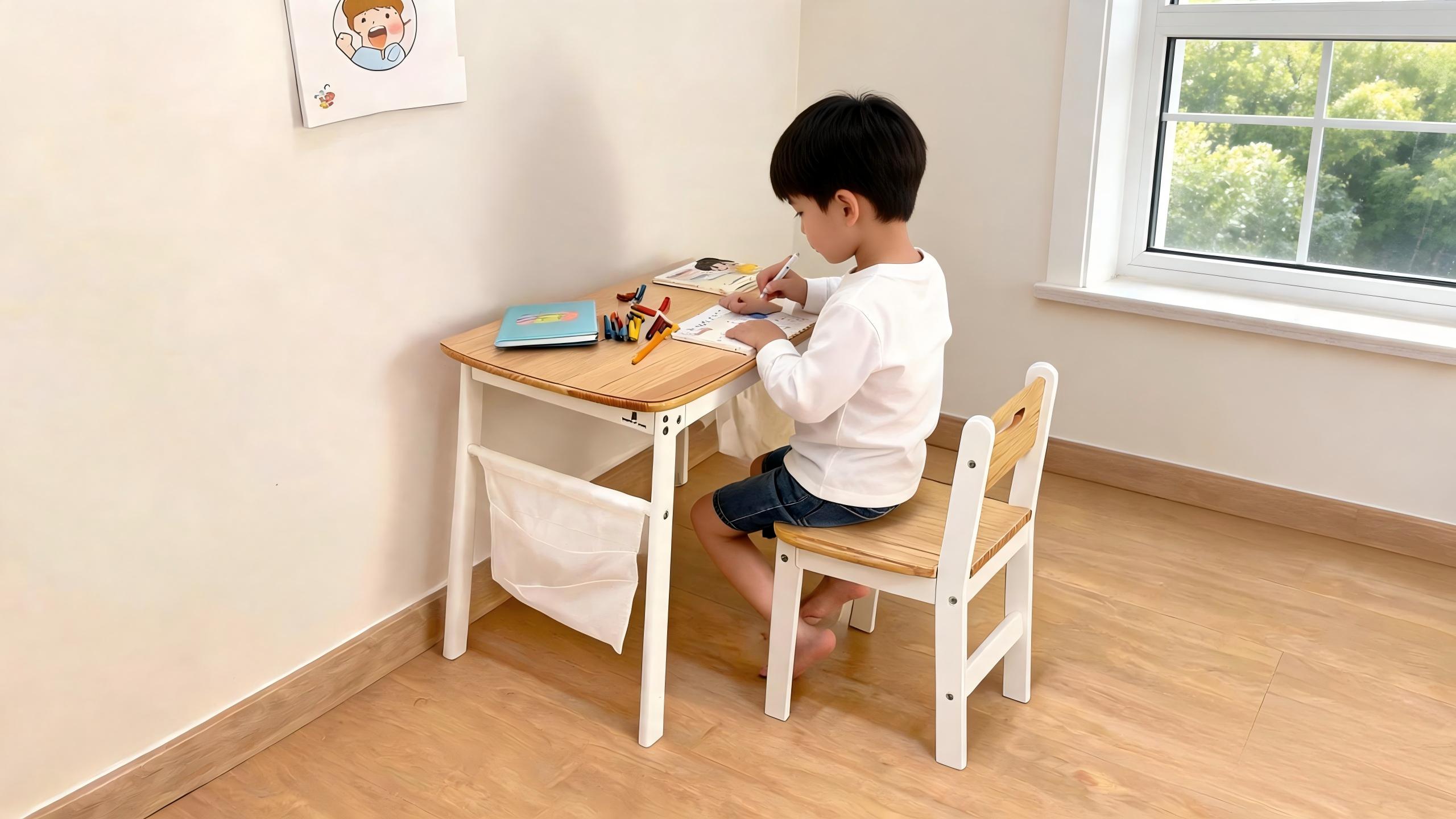 Reversible kids desk with storage bags, curved edge, and anti-tip chair in a small bedroom setup.