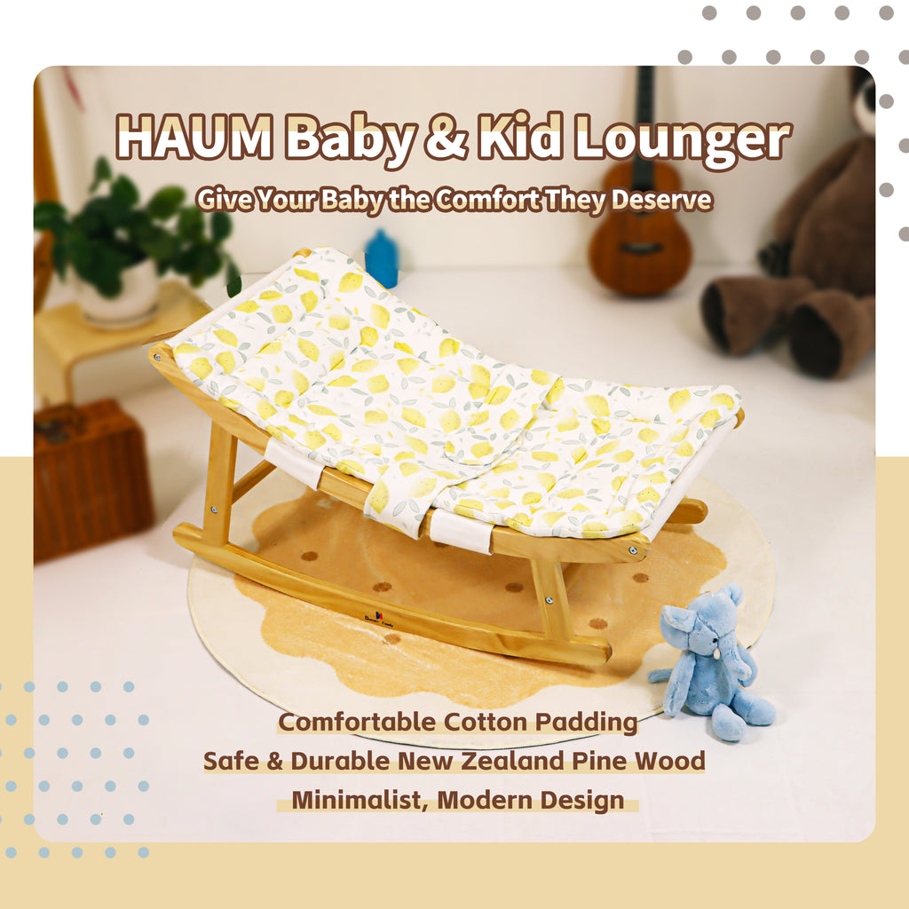 Parent gently rocking baby in breathable fabric lounger