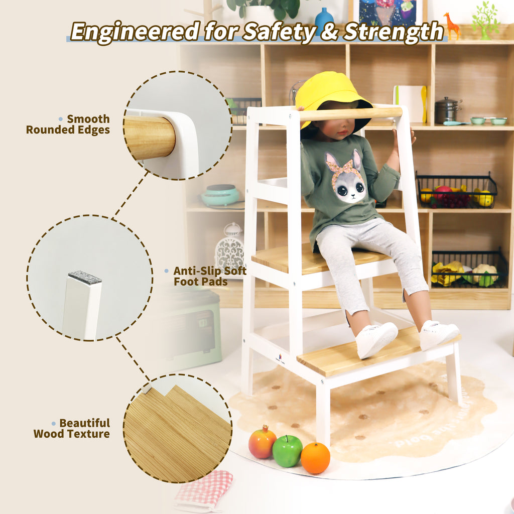Toddler standing tower at kitchen counter helping with cooking