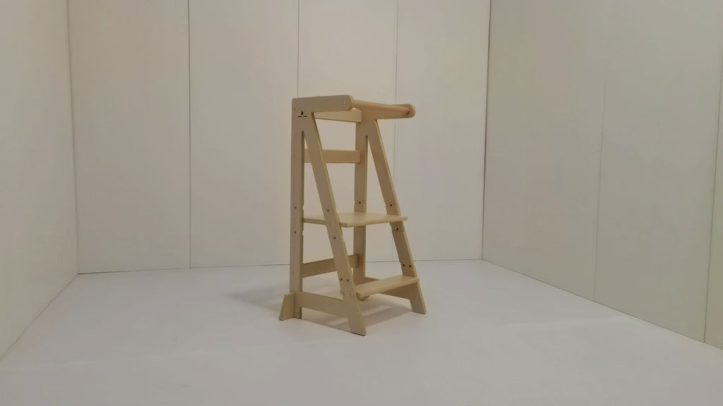 Toddler safely using Eiffel Tower-inspired kitchen helper: Adjusting 3-height premium wood steps with anti-tip base for cooking activities